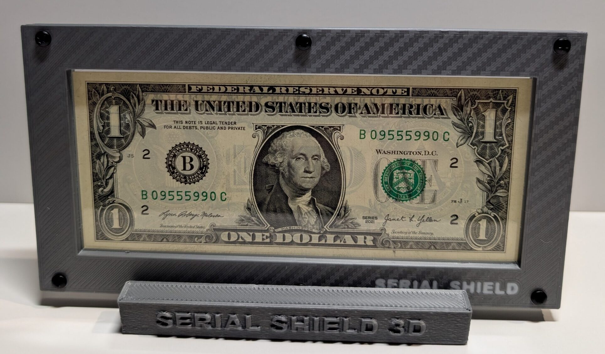 Gray carbon fiber Serial Shield 3D currency frame with stand and 7 mil Mylar window