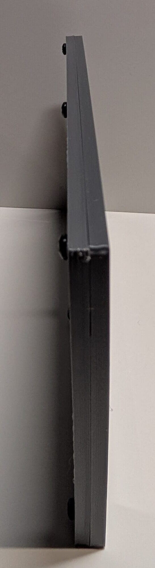 Gray carbon fiber Serial Shield 3D currency frame with stand and 7 mil Mylar window